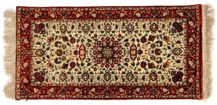 A very fine small ivory ground Tabriz Rug, with all over floral field with centre star medallion