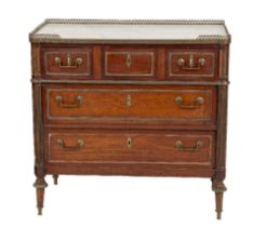 A 19th Century French Commode Chest, the white marble top with pierced brass gallery over three long