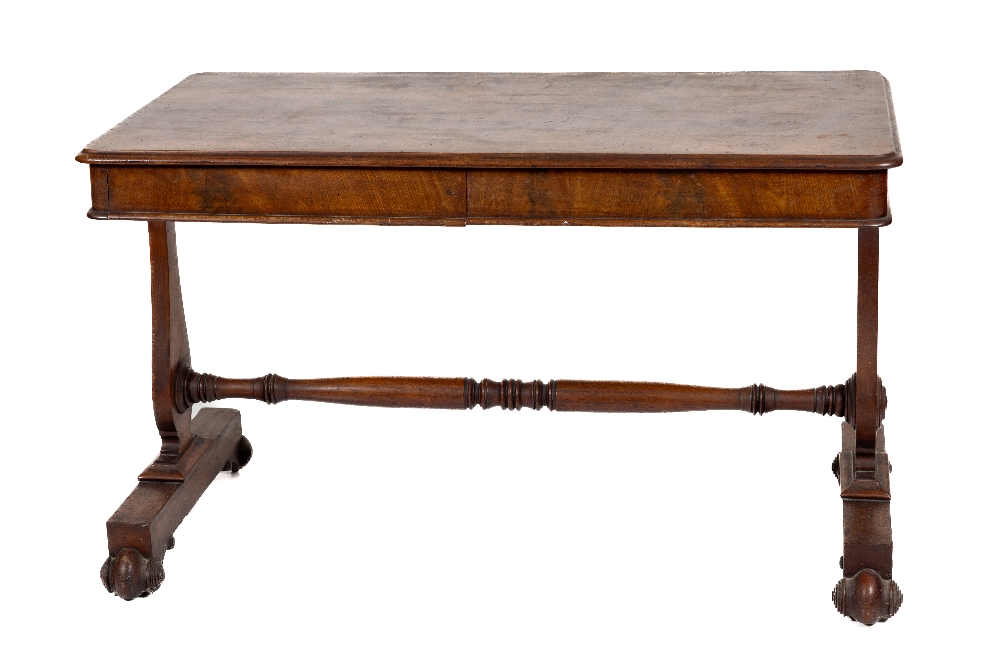 A William IV period mahogany Library Table, the rectangular moulded top with a frieze drawer to