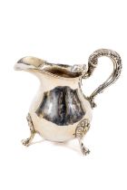 A heavy Victorian Irish crested silver baluster shaped Cream Jug, Dublin 1839 with heavy leaf cast