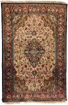 A very attractive Persian Ghom Rug, with centre diamond medallion and colourful floral field and