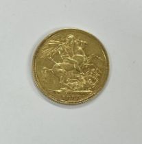 Coins: An 1889 Queen Victoria full Sovereign, (some wear) otherwise good. (1)