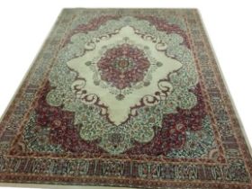 A fine quality Axminister cream ground Middle Eastern style machine turned woollen Carpet, the large