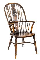 A fine quality late 18th Century elmwood Windsor Chair, the arched spindle back with central