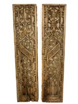 A pair of carved Flemish 17th Century Panels, decorated with bouquets of flowers and 'C' scroll