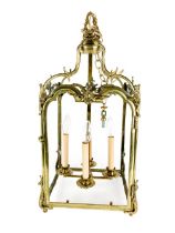 A 19th Century ornate brass Hall Lantern, with leaf decorations and four panels (lacks glass)