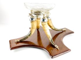 An unusual large Table Centre, supported by cornucopia style horns with plated dolphin head