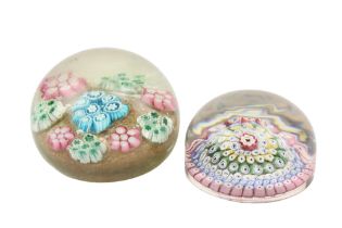 A heavy Millefiori circular dome top glass Paperweight, 8cms (3 1/4"); and a larger heavier ditto