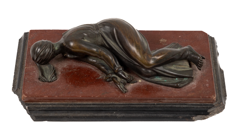 A 19th Century bronze and marble Paperweight, depicting a young lady resting on a rouge marble and