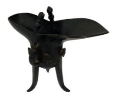 A very good 18th Century bronze Ritual Wine Vessel, Jue, typically standing on a tripod, the deep