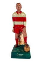 G.A.A.: a hand painted plaster Figure of a Footballer "Derry," in standing position with foot on