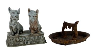 Advertisement: A Spelter Model of two Dogs, 'Black and White Whisky,' Buchanans; together with a