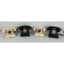 Two Vintage black ring dial Bakelite Telephones, and two white similar ditto. (3)