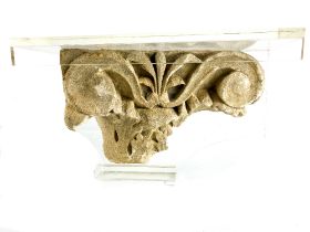 A Medieval carved sandstone Pillar Capital Fragment, in conservation mount, approx. 20cms x 36cms (