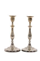 A pair of 19th Century Sheffield plated Table Candlesticks, each with a reeded baluster stem,