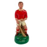 G.A.A.: a hand painted plaster figure of a hurler "Cork", in grouched position with sliotar and