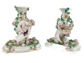 A pair of Sitzendorf flower encrusted baluster shaped Vases, with Gardener and Cherubs on