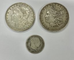 Coins: A silver 1855 American One Dollar Coin, and a 1921 American One Dollar, a George III 1817