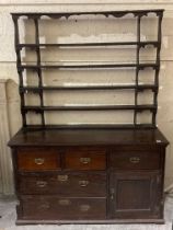 A 19th Century composition oak Welsh Dresser, the open top with shaped supports and four shelves