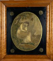 An early 19th Century oval silk Needlework Picture, depicting a seated Woman and Dog, 30cms x