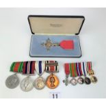 Bar with 2 Second World War Medals and 2 Police Service Medals, miniature medals and MBE medal