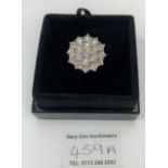 18k white gold and diamond cluster ring