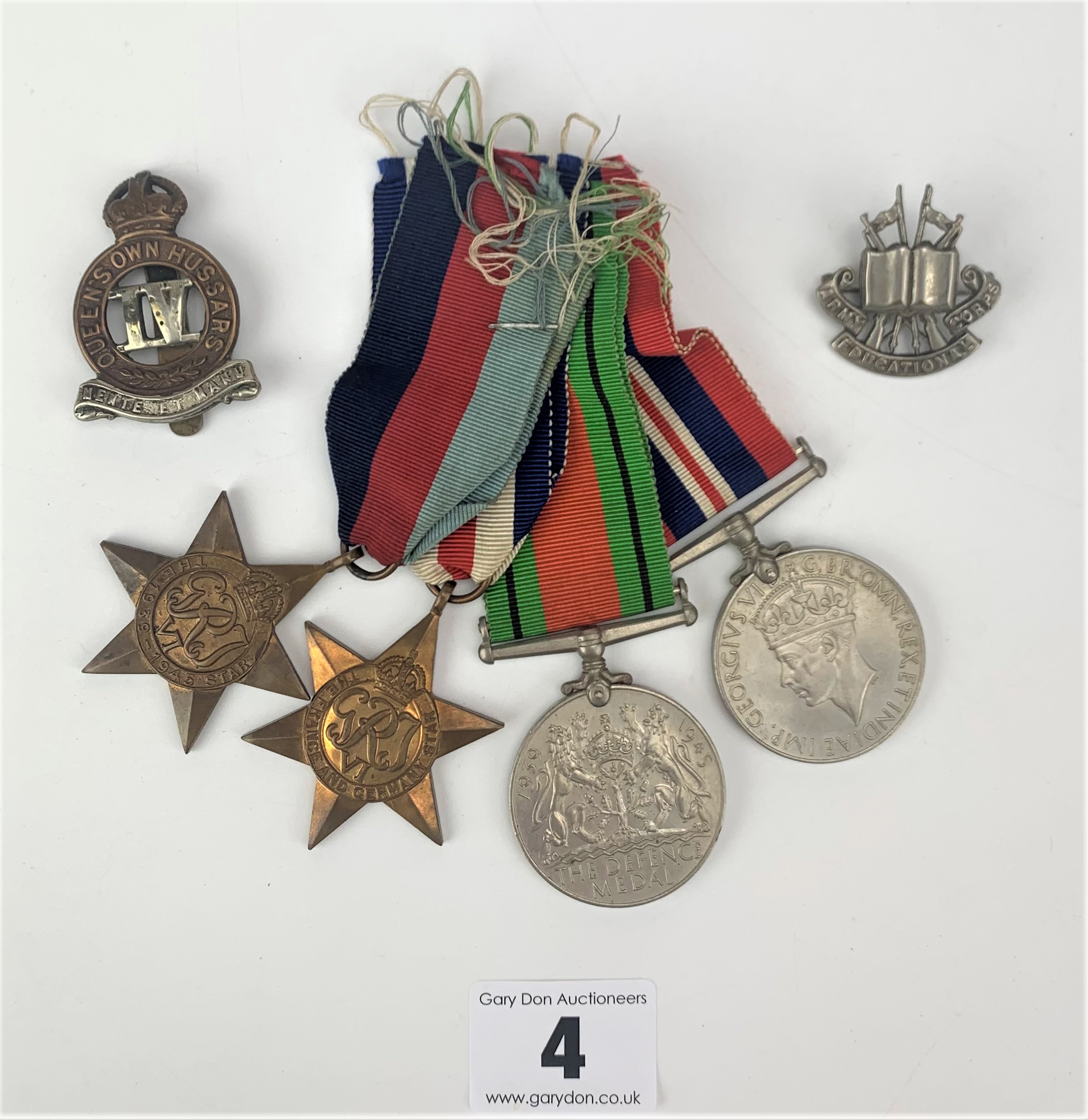 4 Second World War medals and 2 cap badges