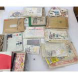 Quantity of loose mixed stamps, part stamp albums, post cards, attached stamps, mixed first day