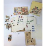 Box of mixed loose stamps, world stamp album and coronation pin badge