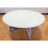 Large glass topped round white table