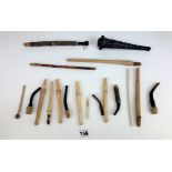 Box of mixed pipe steams, black carved pipe and pipe mouth pieces