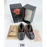 Pair of child's antique leather shoes with photograph