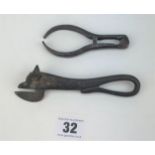 1885 bulls head can opener and metal tongs