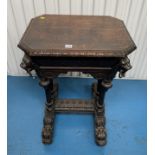 Carved oak side table with lion handles