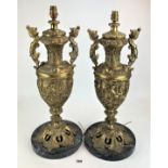 Pair of figured brass table lamps