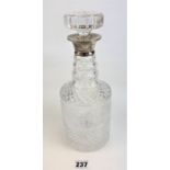 Silver rimmed cut glass decanter