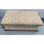 Antique upholstered ottoman