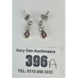 Pair of 18k gold ruby and diamond drop earrings