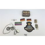 Mixed badges, tags and patches in tin