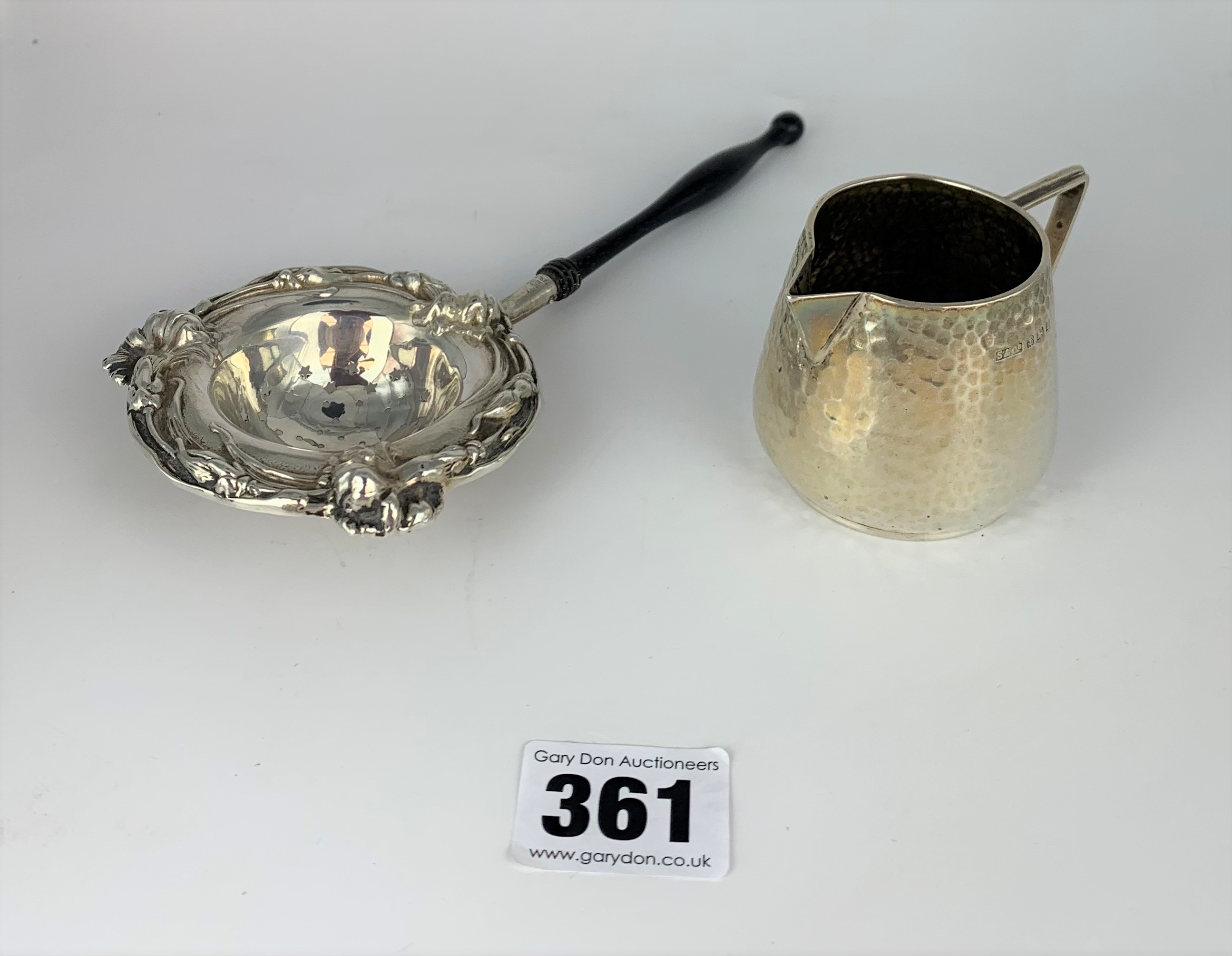 Silver jug and silver teastrainer