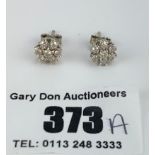 Pair of 18k gold diamond cluster earrings