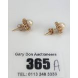 Pair of 14k gold pearl and diamond stud earrings