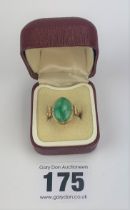 14k gold ring with green stone