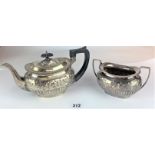 Silver teapot and sugar bowl