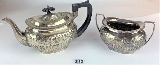 Silver teapot and sugar bowl