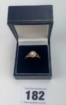 14k gold ring with white stones