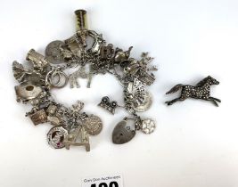 Silver charm bracelet and brooch