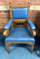 Carved blue leather armchair