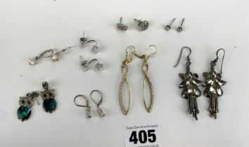 8 pairs of silver earrings