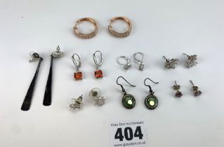 8 pairs of silver earrings